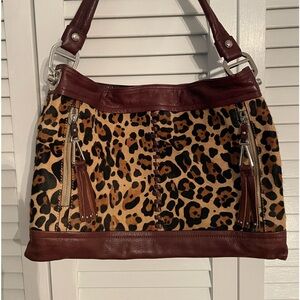 B.Makowsky pony hair and leather leopard print purse.